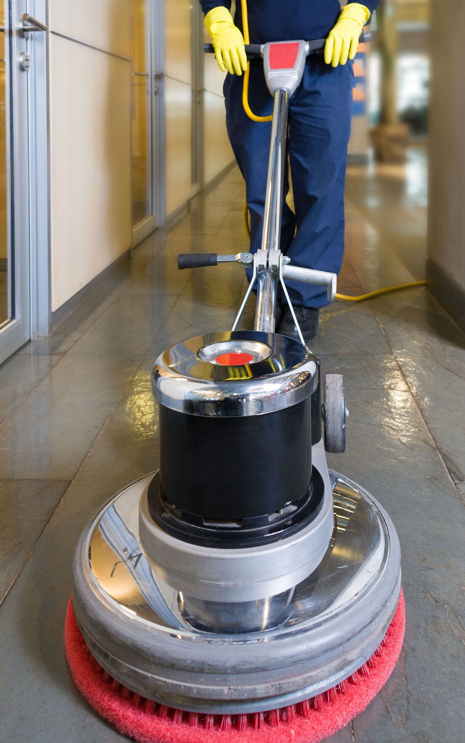 Janitor cleaning floor in Rochester NY office building